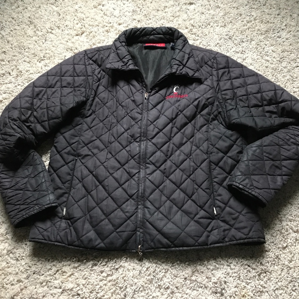 University of Cincinnati quilted jacket. Black with UC red emblem.